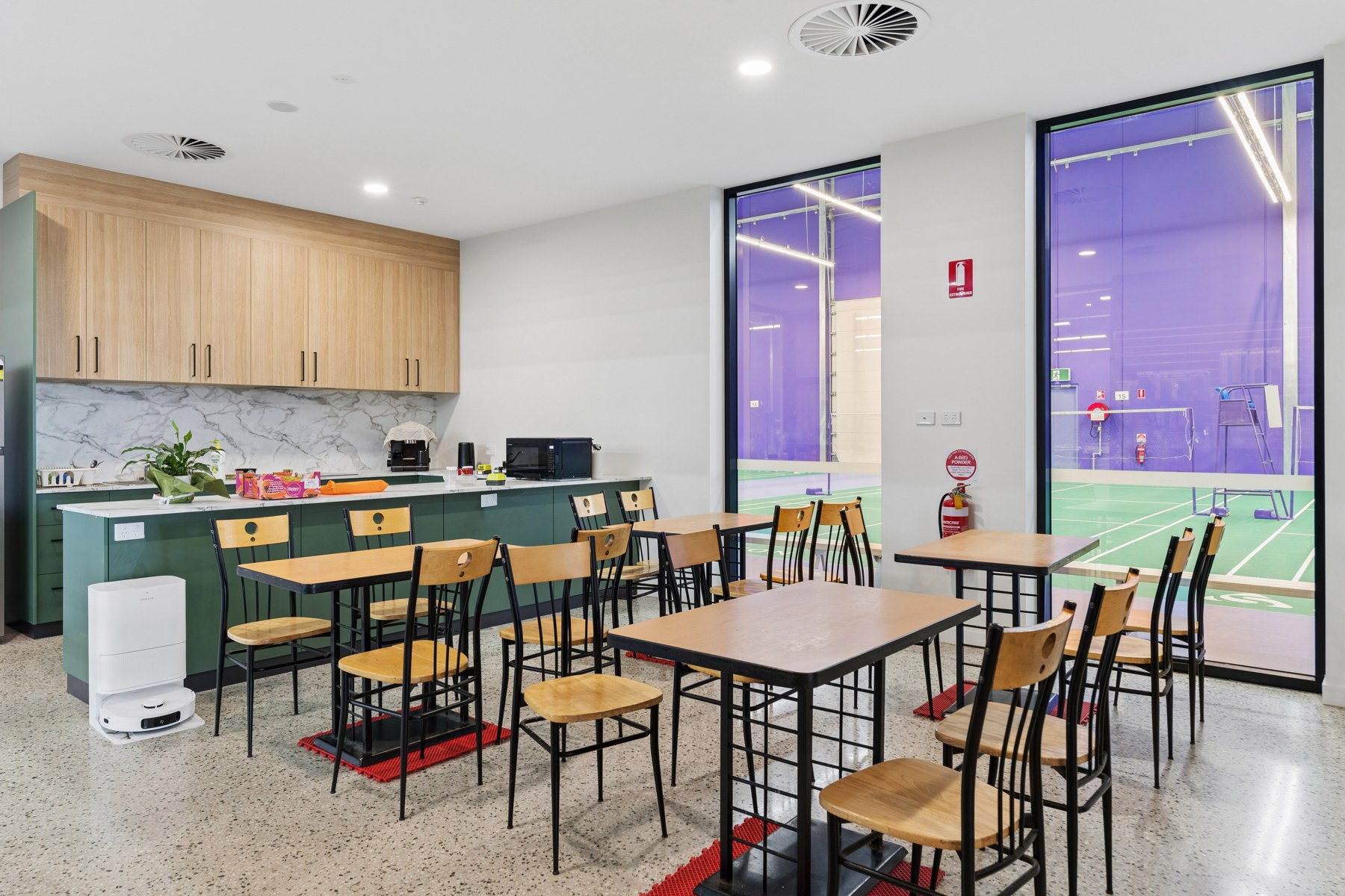 Lounge tables and seating overlooking the courts